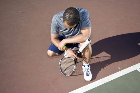 A tennis player with ankle injury
